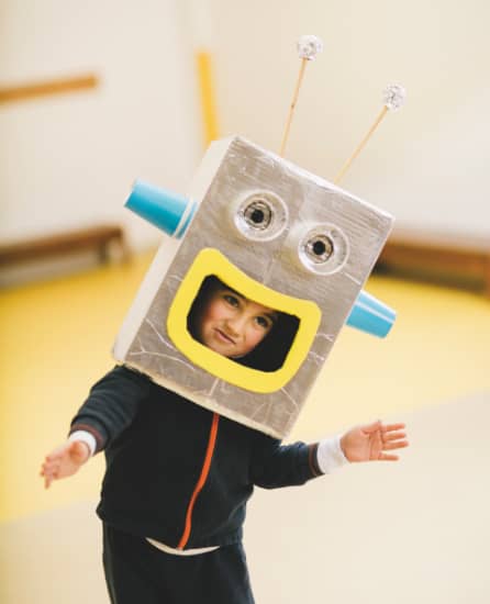 Boy playing with a robot mask